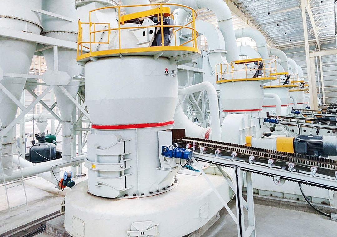 Industrial grinding mill in a factory setting