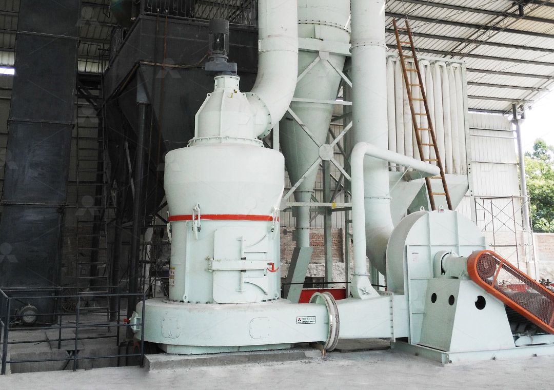 Industrial grinding mill in a factory setting